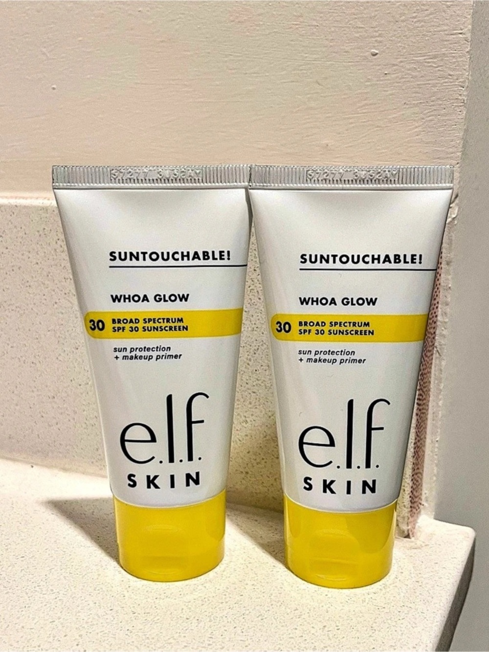 TWO e.l.f. Suntouchable! Whoa Glow SPF 30 Sunscreen & Primer. SPF 30 Sunscreen
